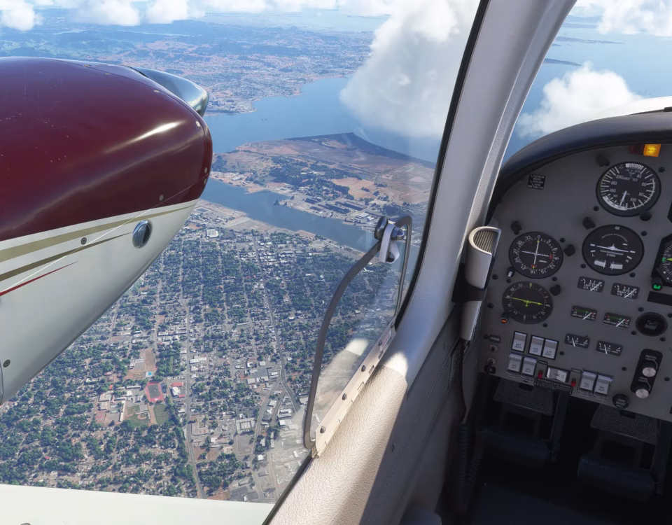 Cockpit view from a Cessna 414, looking out the left window at sunny skies and clouds over terrain 6,500 feet below
